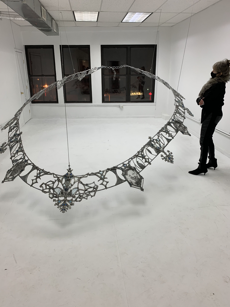 Marsha Pels: Fallout Necklace from Trophies of Abuse 2015-2018. Installation Lubov, NY 2020. Patinated cast aluminum, patinated steel, flame-worked glass, and powder-printed glass 213 x 300 x 450 cm.