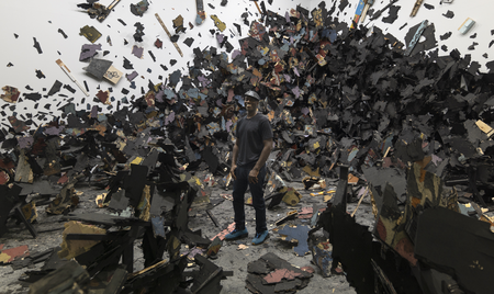 The artist Leonardo Drew, with Number 341, 2022, Art Basel: Unlimited, Switzerland. © Leonardo Drew, Photo: Jon Cancro. Courtesy of Goodman Gallery, Galerie Lelong & Co., Anthony Meier Fine Arts