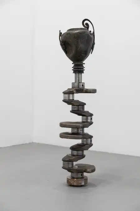 Nicolás Lamas<br />Rotational friction 2, 2023<br />Metal car part and metallic pot<br />74 x 15 x 15 cm<br />29 1/8 x 5 7/8 x 5 7/8 inches<br />Copyright the artist and Meessen De Clercq<br />Photo: Dirk Tacke