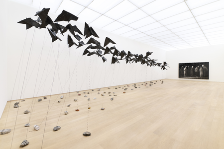 Stillness in the storm, gallery view 1. Photo: Antoine van Kaam links: Arturo Hernández Alcázar (1978) Black Kites (Bird of III Omen), 2010- 2012 Collection museum Voorlinden. Right: Robert Longo (1953) untitled (Prisoners, Kandahar Airport), 2016 Collection museum Voorlinden c/o Pictoright Amsterdam, 2026