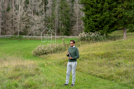 Micheal Moling in Val dl’Ert, sculpture park of SMACH. In the back ground: Conor McNally, Ciasa, 2019.