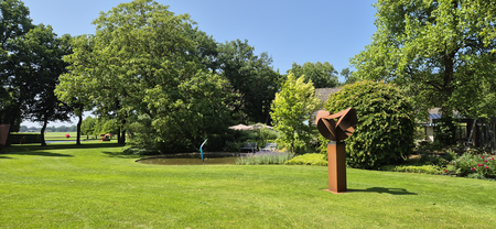 View of BIG Art & Garden with a sculpture by Marco Goldenbeld in the foreground.