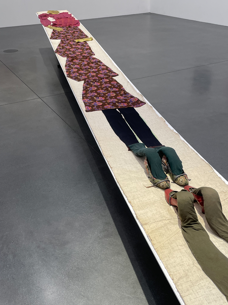 Mariuccia Secol, Frauenbrücke (eng. Woman Bridge), 1989, clothes on canvas, shoes, plastic film, 1000 x 56 cm