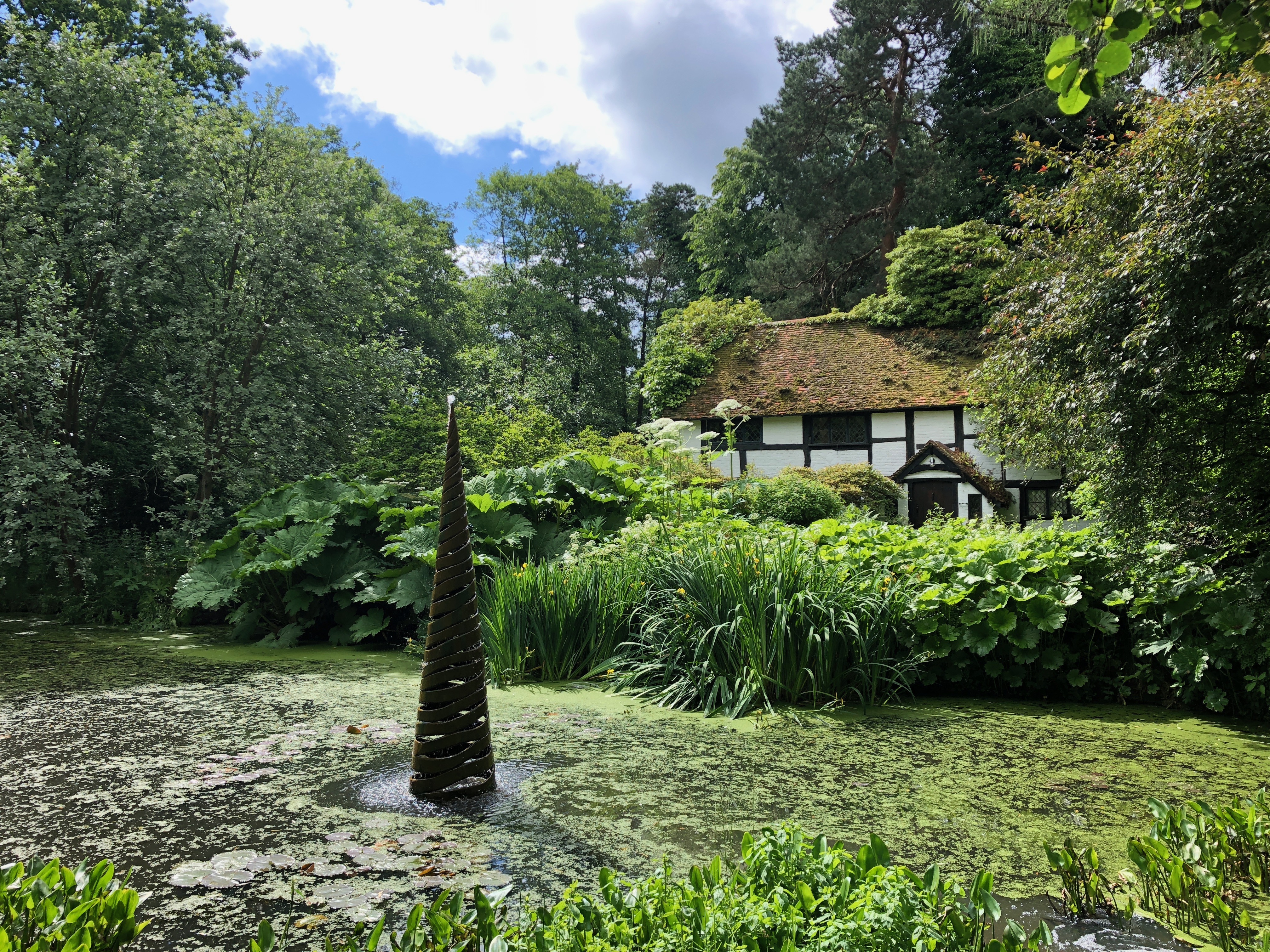 Scylla' Giles Rayer in front of Black & White Cottage