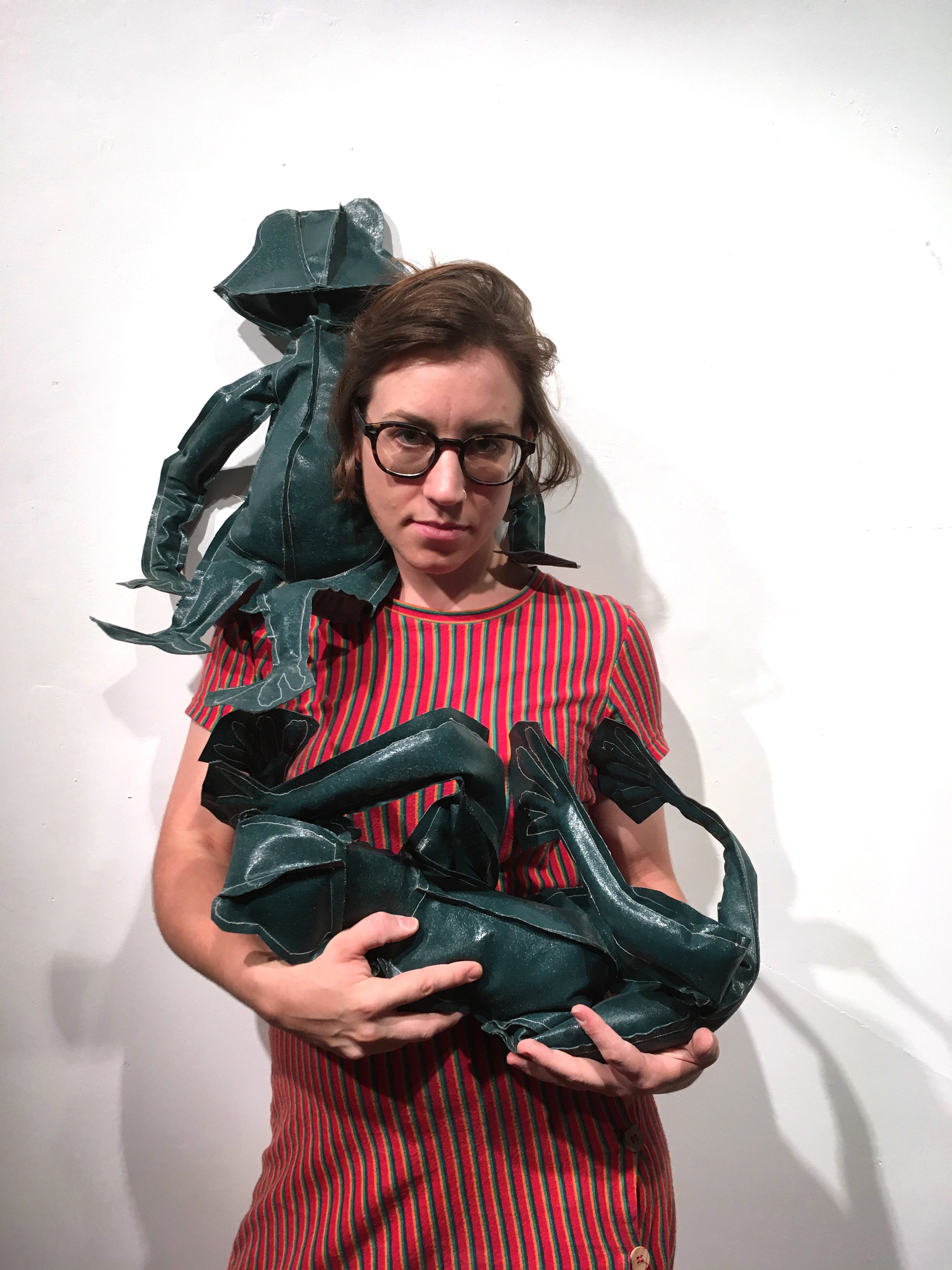 Anna Reading with tarpaulin frog sculptures made during a residency at AVA in Hong Kong, 2017